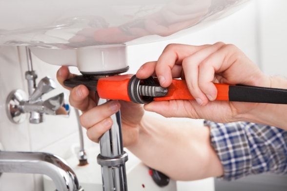 Pearland Plumber working on sink